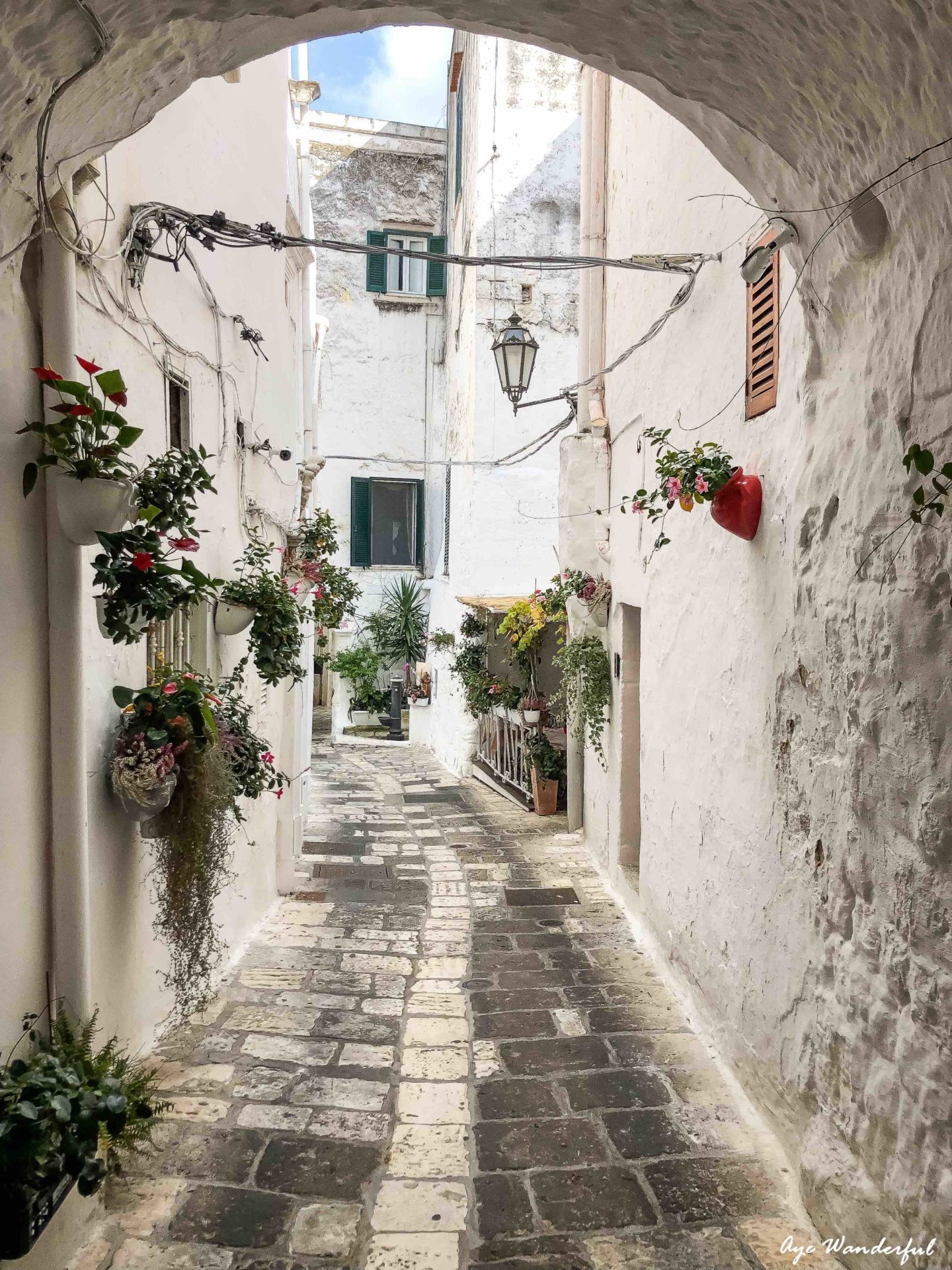 A travel guide for a quick getaway to Italy with everything you need to know about how to spend 2 days in Puglia in the charming towns of Ostuni and Alberobello.